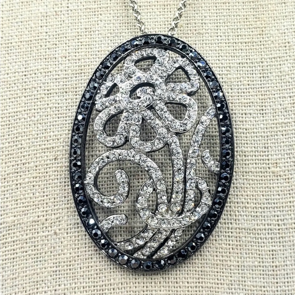 Nolan Miller beautiful silver plated pendant with chain.